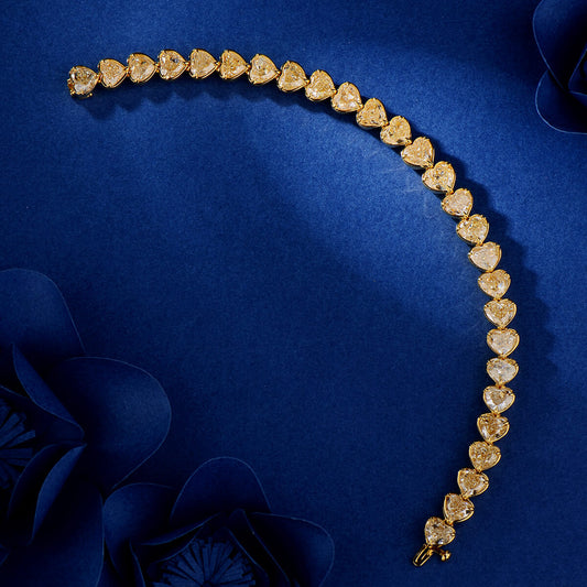 Natural Fancy Yellow Diamond Tennis Bracelet, 18K Yellow Gold, Heart Shape, 26.97 Ct. TW